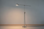 Adjustable floor lamp with sleek pole and adjustable head on a neutral background, realistic photo