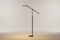 Adjustable floor lamp with warm light and modern design on a neutral background