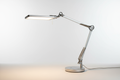 LED desk lamp with adjustable brightness and angle on a neutral background, realistic photo