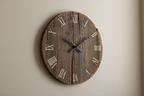 Rustic wooden wall clock on a plain neutral background, realistic photo. 